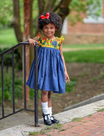 African American girl wearing an African print outfit