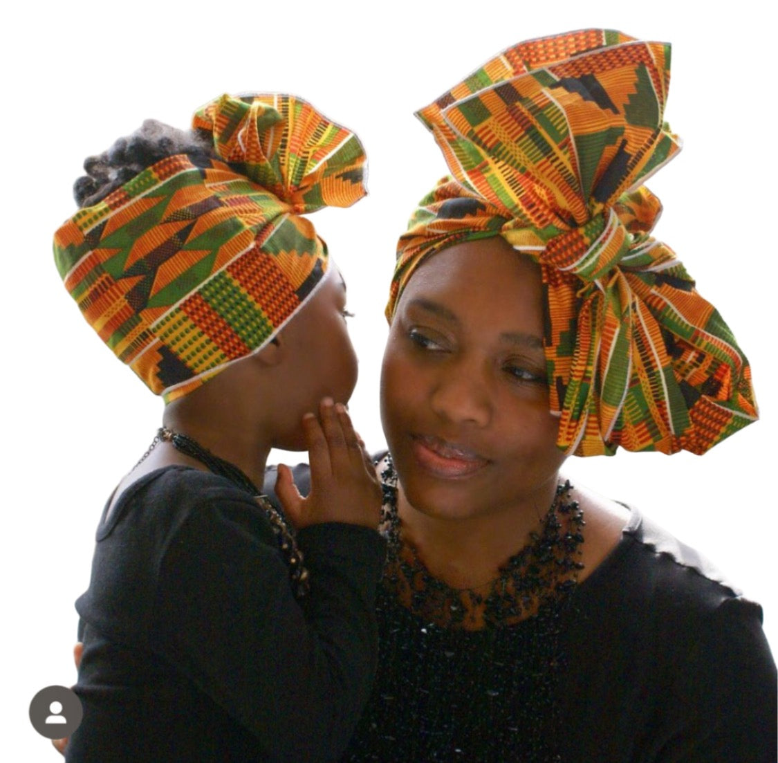 Kente African print head wrap for mommy and child. An African American mommy and little girl is shown modeling the headwra