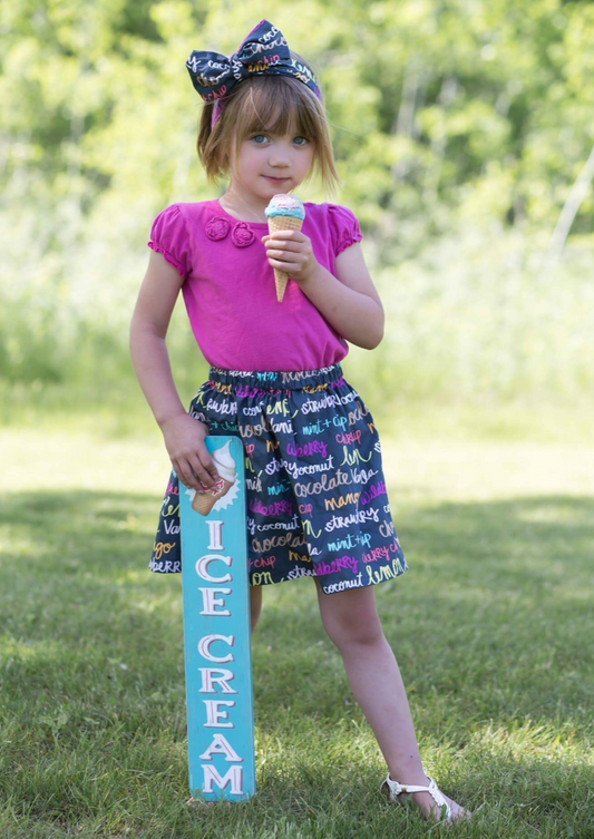 Faded black ice cream skirt with colorful ice cream flavor prints on the fabric. 
